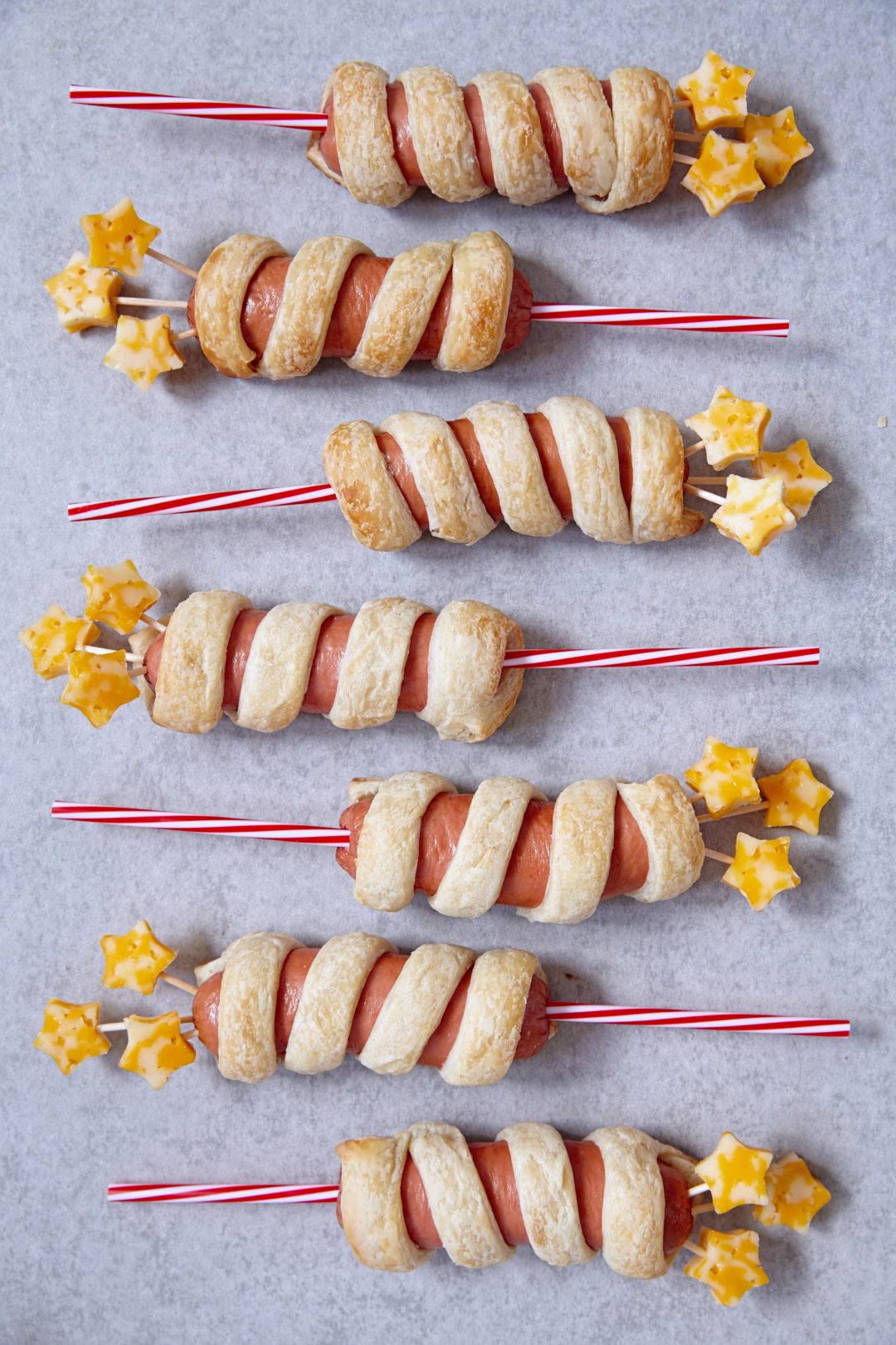 Hot dogs with red relish white sauce and blue cheese